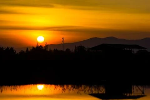 Sunset over lagoon Stock Photos