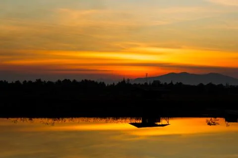 Sunset over lagoon Stock Photos