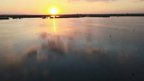 Sunset over lake - 4K Cinematic Drone footage Stock Footage 140333469