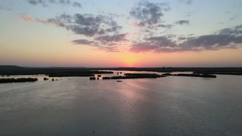 Sunset over lake - 4K Cinematic Drone footage Stock Footage 140333471