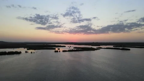 Sunset over lake - 4K Cinematic Drone footage Stock Footage 140333472