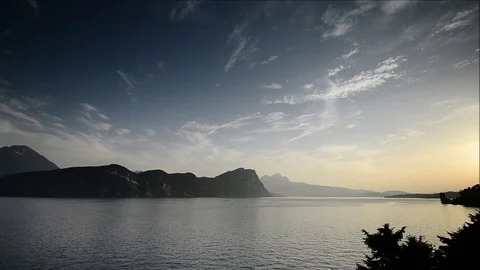 Sunset over the lake and the Alps mountains. Switzerland. Stock Footage 112293276