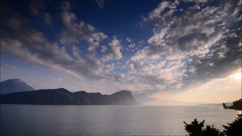 Sunset over the lake and the Alps mountains. Switzerland. Stock Footage 112296580