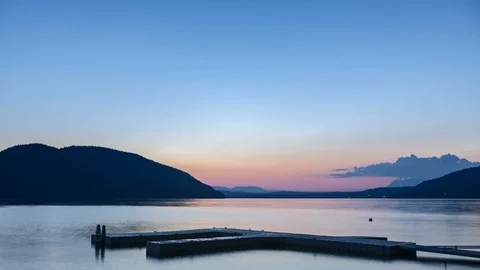 Sunset Over Lake And Dock Time Lapse Stock Footage
