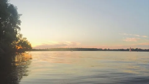 Sunset over lake and forest in summer timelapse 動画素材 79807997