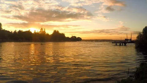 Sunset over lake and forest in summer 스톡 동영상 82369189