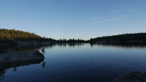 Sunset over a lake and mountains Stock Footage 112586949