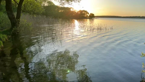 Sunset over the lake. Awesome Sunset with dramatic clouds Stock Footage 276736085