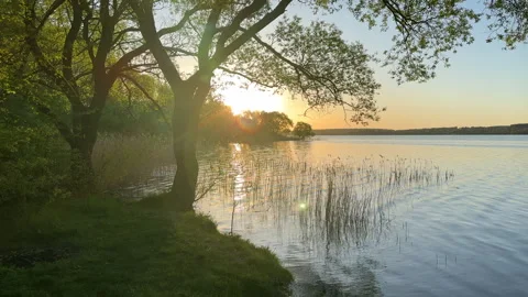 Sunset over the lake. Awesome Sunset with dramatic clouds Stock Footage 276736086