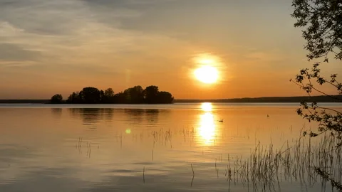 Sunset over the lake. Awesome Sunset with dramatic clouds Stock Footage 276736584