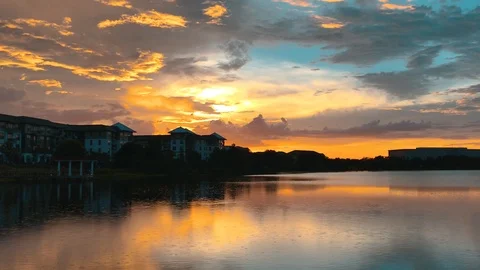 Sunset over lake in Baldwin Park Florida Stock Footage