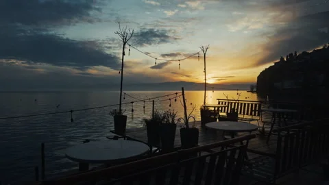 Sunset over the lake with a cafe deck in Ohrid Stock Footage 304918582