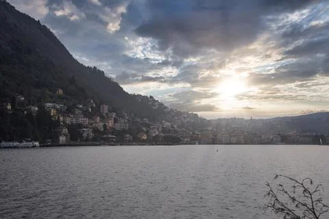 Sunset Over Lake Como with Hillside Town and Docked Ferry Stock Photos