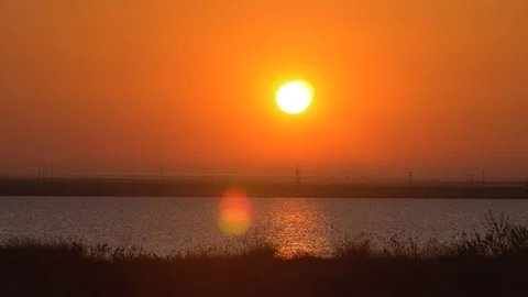 Sunset over the lake in early spring Stock Footage 110244718