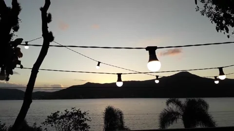 Sunset over the Lake with Modern Light Bulbs 3 Stock Footage 162243779