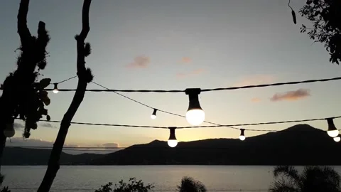 Sunset over the Lake with Modern Light Bulbs 2 Stock Footage 162243782