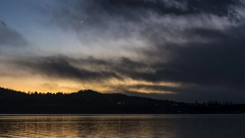 Sunset over the lake with Moon in the sky Stock Footage 104846248