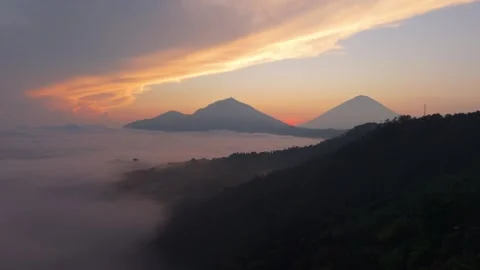A sunset over a lake with mountains in the background Stock Footage 265448108