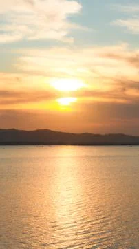 Sunset over the lake with mountains in the background, Indonesia. Fotos de archivo