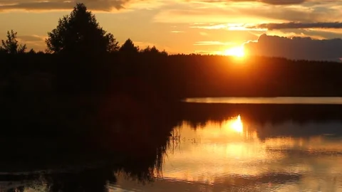 Sunset over a lake in the mountains Stock Footage 234815515