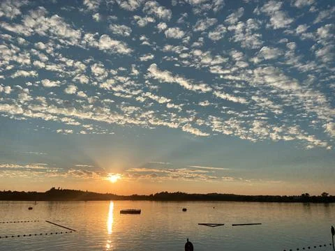 Sunset over the lake of Pfaeffikon with clouds on the sky Stock Photos