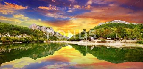 Sunset over the lake Stock Photos