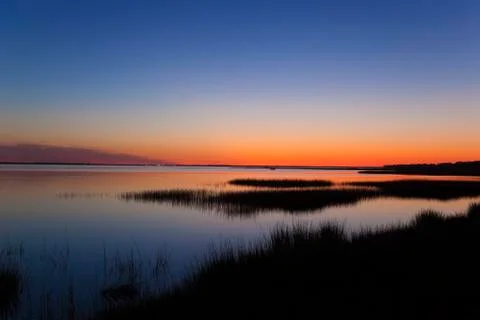 Sunset over the lake Stock Photos