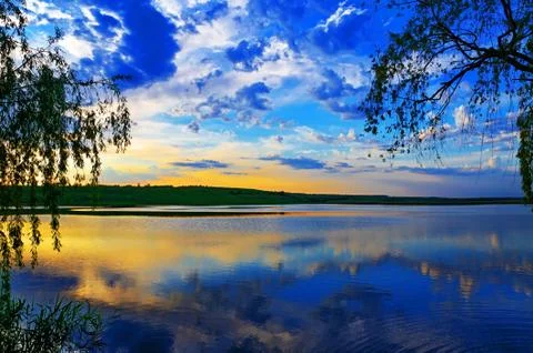 Sunset over lake Stock Photos