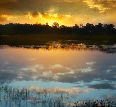 Sunset over a lake Stock Photos