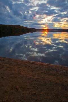 Sunset over the lake Stock Photos