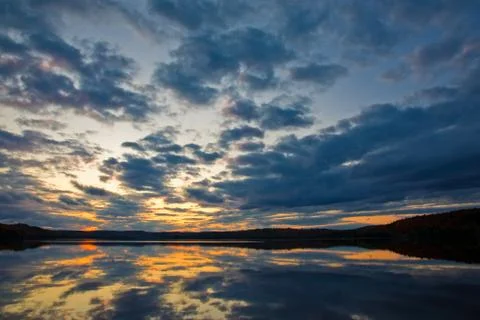 Sunset over the lake Stock Photos
