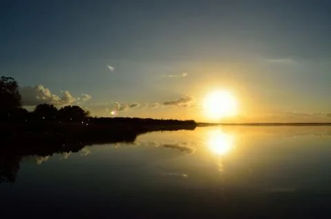 Sunset over lake Stock Photos