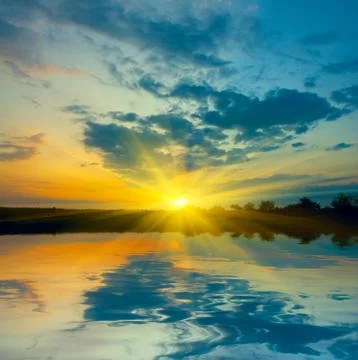 Sunset over lake Stock Photos