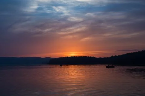 Sunset over a lake Stock Photos