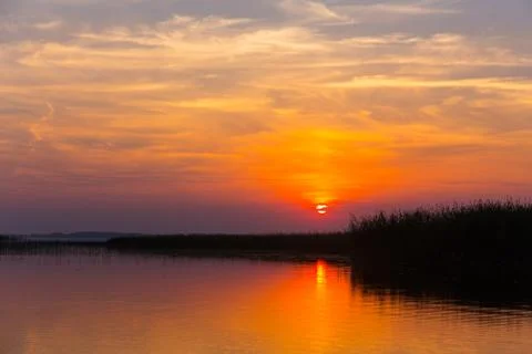 Sunset over the lake Stock Photos