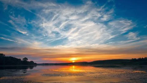 Sunset over lake Stock Photos