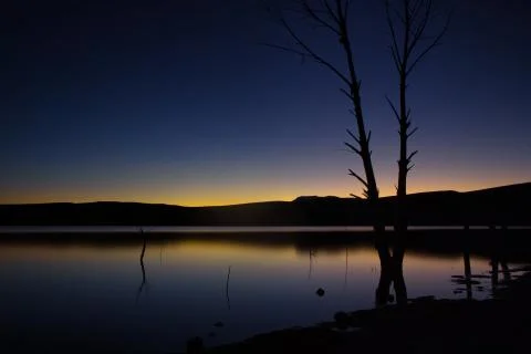 Sunset over the lake Stock Photos