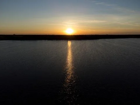 Sunset over lake Stock Photos