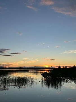 Sunset over the lake Stock Photos