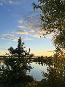 Sunset over the lake Stock Photos