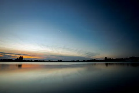 Sunset over lake Stock Photos