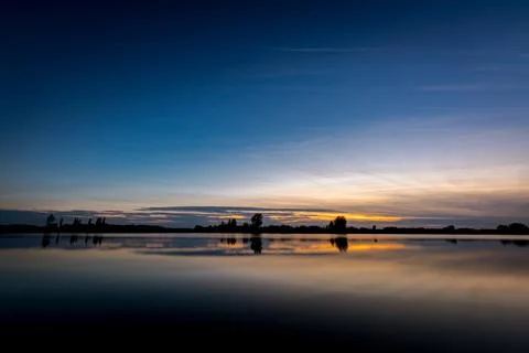 Sunset over lake Stock Photos