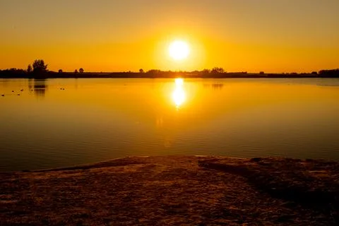 Sunset over lake Stock Photos