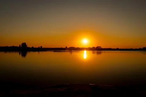 Sunset over lake Stock Photos