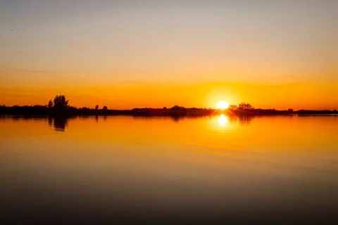 Sunset over lake Stock Photos