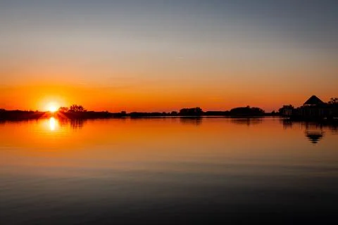 Sunset over lake Stock Photos
