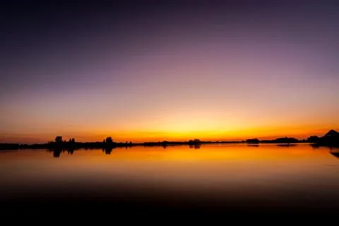 Sunset over lake Stock Photos