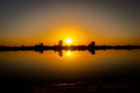 Sunset over lake Stock Photos