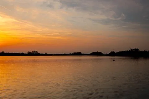 Sunset over lake Stock Photos