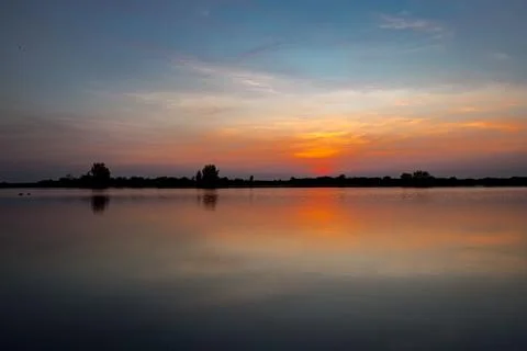 Sunset over lake Stock Photos